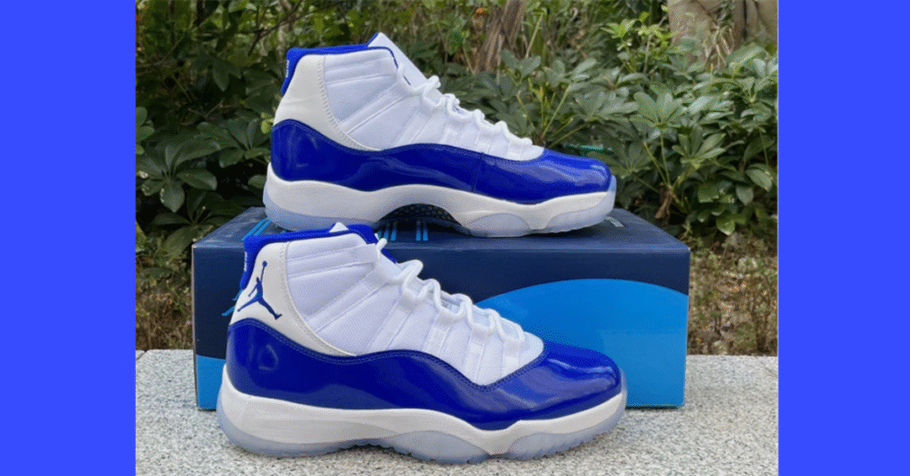 Air Jordan 11 CT8012-114 Royal Blue men’s sneakers with white upper and royal blue patent leather mudguard, side profile on clean background.