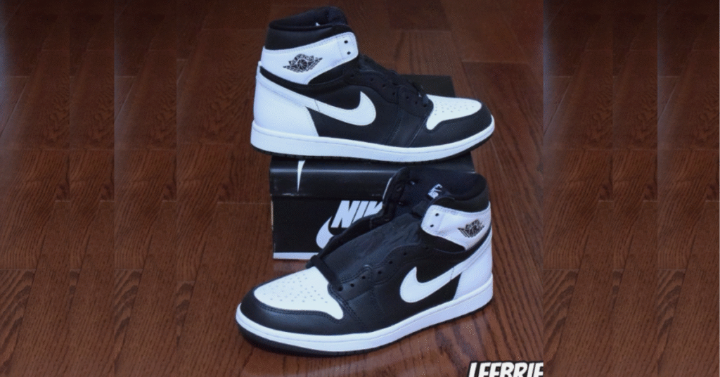 Nike Air Jordan 1 High OG Black White sneaker on a solid background.